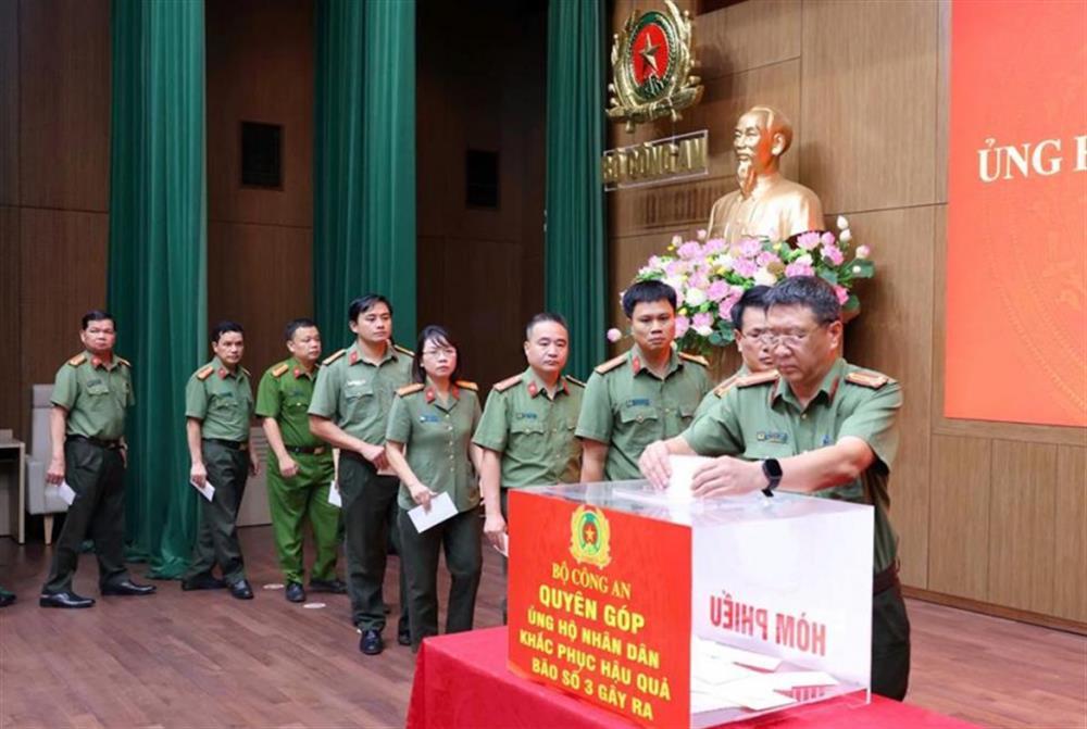 Public security officers donate money in support of disaster-affected people at MPS's fundraising event.