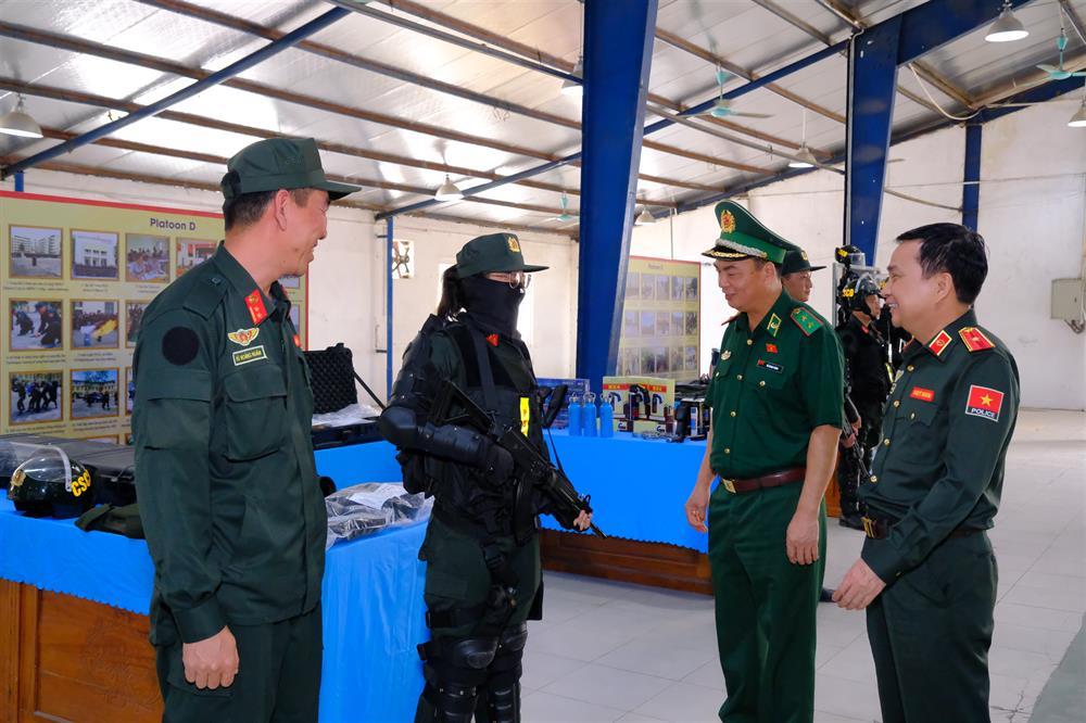 Delegates tour an exhibition of vehicles, equipment and facilities at the training center.