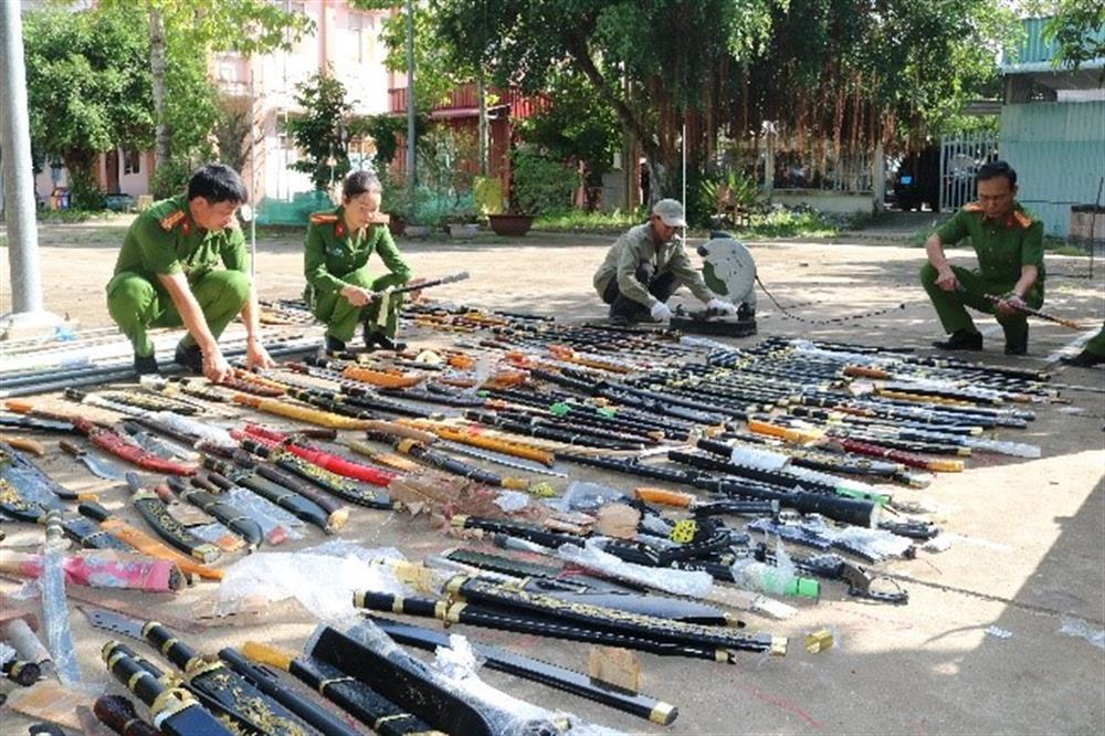 Police destroy illegal weapons and related items.