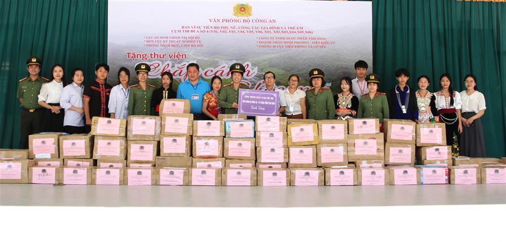 Delegates present books to for “Wings of Dreams” library.