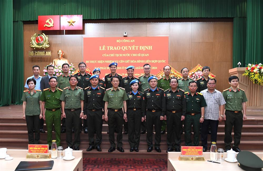 Delegates join in group photo.