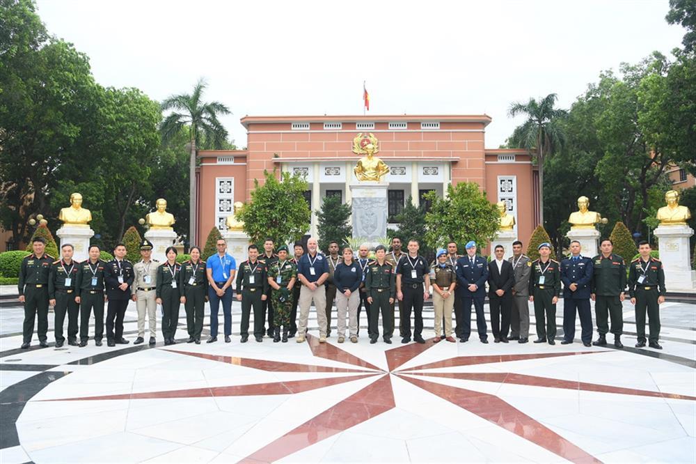 Delegates join group photo.