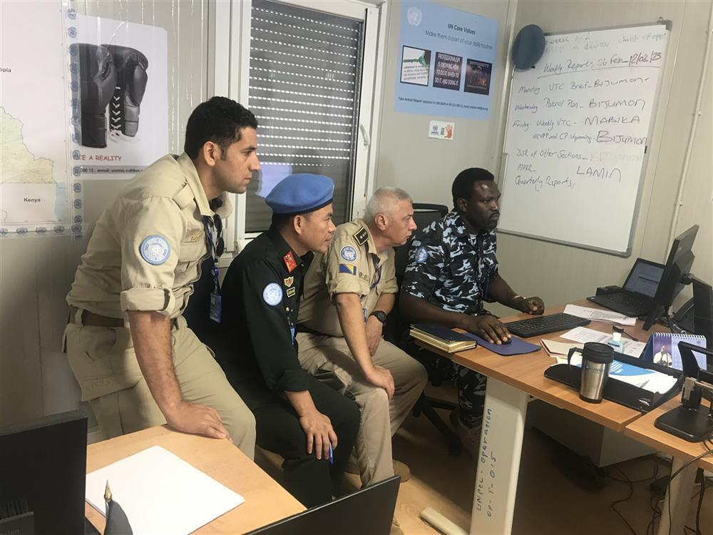 Vietnamese police officer works colleagues from other countries at UNMISS.